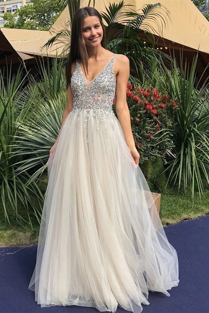 prom dresses with beaded accentsA Line V Neck Backless Beaded Ivory Prom Dresses Sequins Backless Formal Dresses